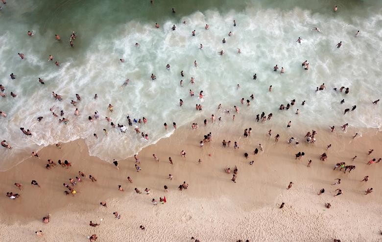 People enjoy at Ipanema beach, amid the coronavirus outbreak, in Rio de Janeiro, Brazil. REUTERS/Pilar Olivares  